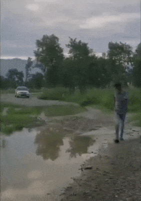 Car puddle and guy