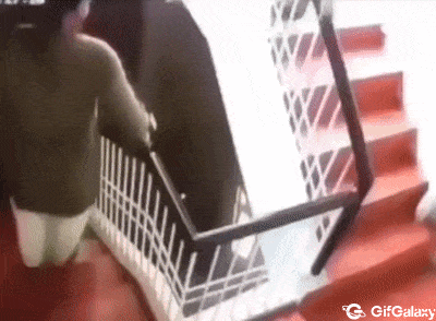 Child comes down the stairs and the handrail