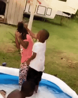 Girl knocks down boy in pool