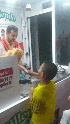 Boy paying ice cream