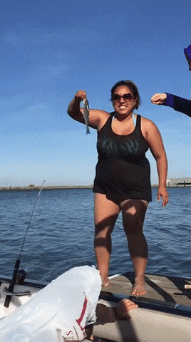 Girl throws fish in sea