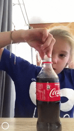 Little girl and trick with Coca Cola