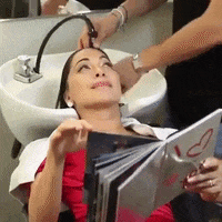 Girl at hairdresser and hair washing