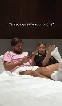 Girlfriend checks phone from boyfriend