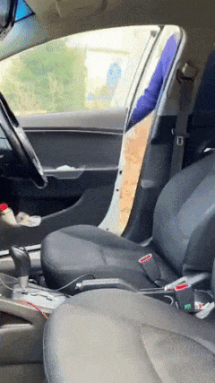 Girl in car adjust seat