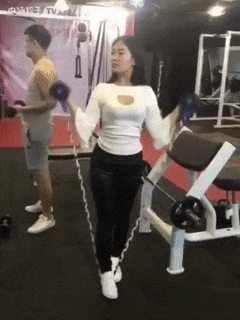 Girl exercise with elastic rope