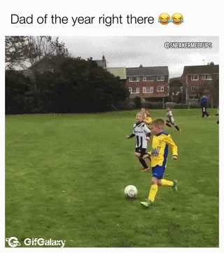 Football coach and boy in goal