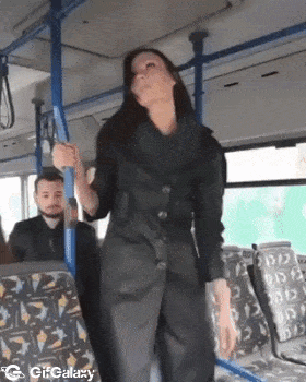 Small man and large woman in bus