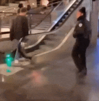Prank with police on escalator