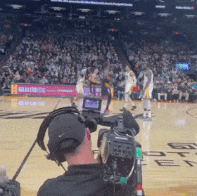 Basketball game cameraman