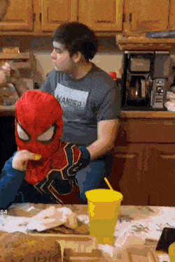 Spiderman eats cookie