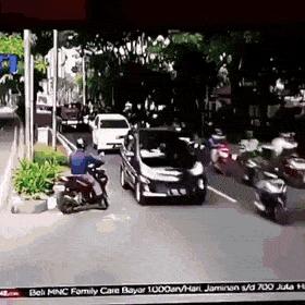 Police officer catches motorcyclist