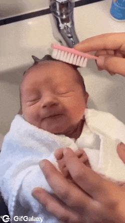 Baby and combing hair