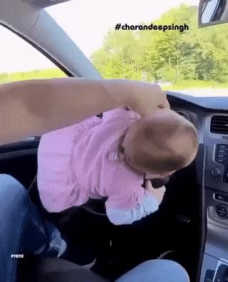 Baby at wheel in car