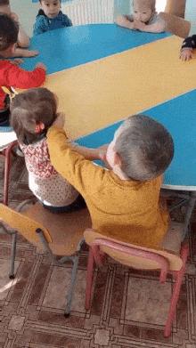 Boy and little girl in kindergarten