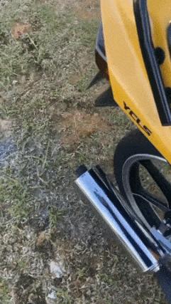 Boy with water and motorcycle