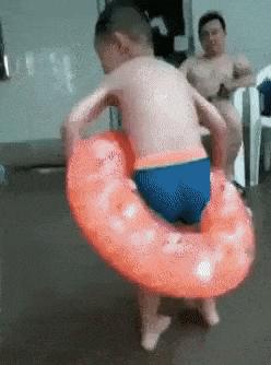Boy jumps into pool