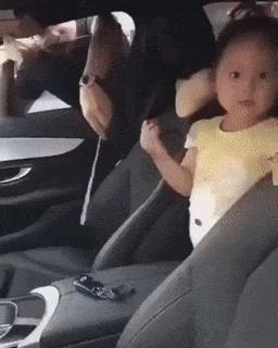 Little girl in car and keys