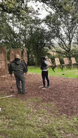 Girl throws the axe