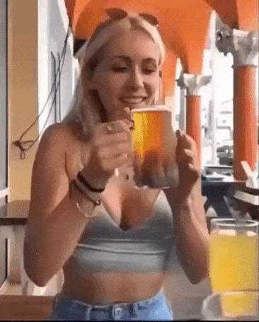 Girl drains pint of beer