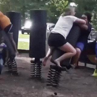 Girl and guy on seesaw