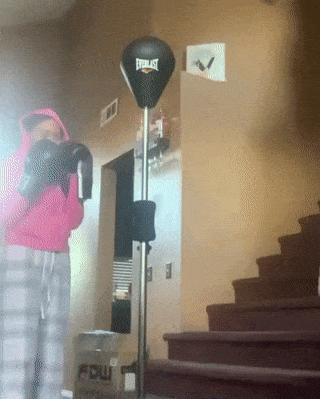 Girl and punching bag