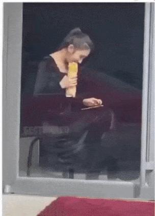 Girl eating big sandwich