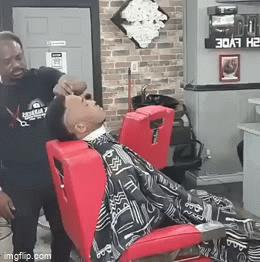 Girl kisses guy at male hairdresser