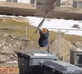 Girl jumps over fence