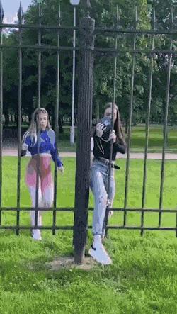 Girl walks through fence