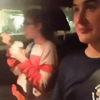 Girl in car eating ice cream