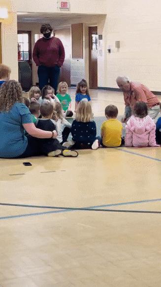 Lizard in hall with children