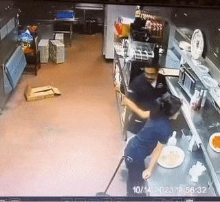 Broom and woman in kitchen