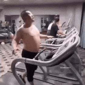 Guy in gym on treadmill