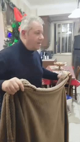 Husband covers his wife with a blanket