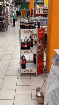 Little girl shaking coca cola