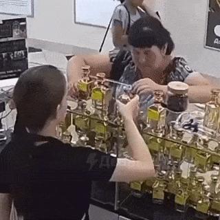 Alcoholic woman in perfumery