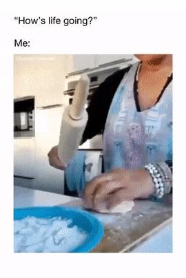 Woman rolls out dough